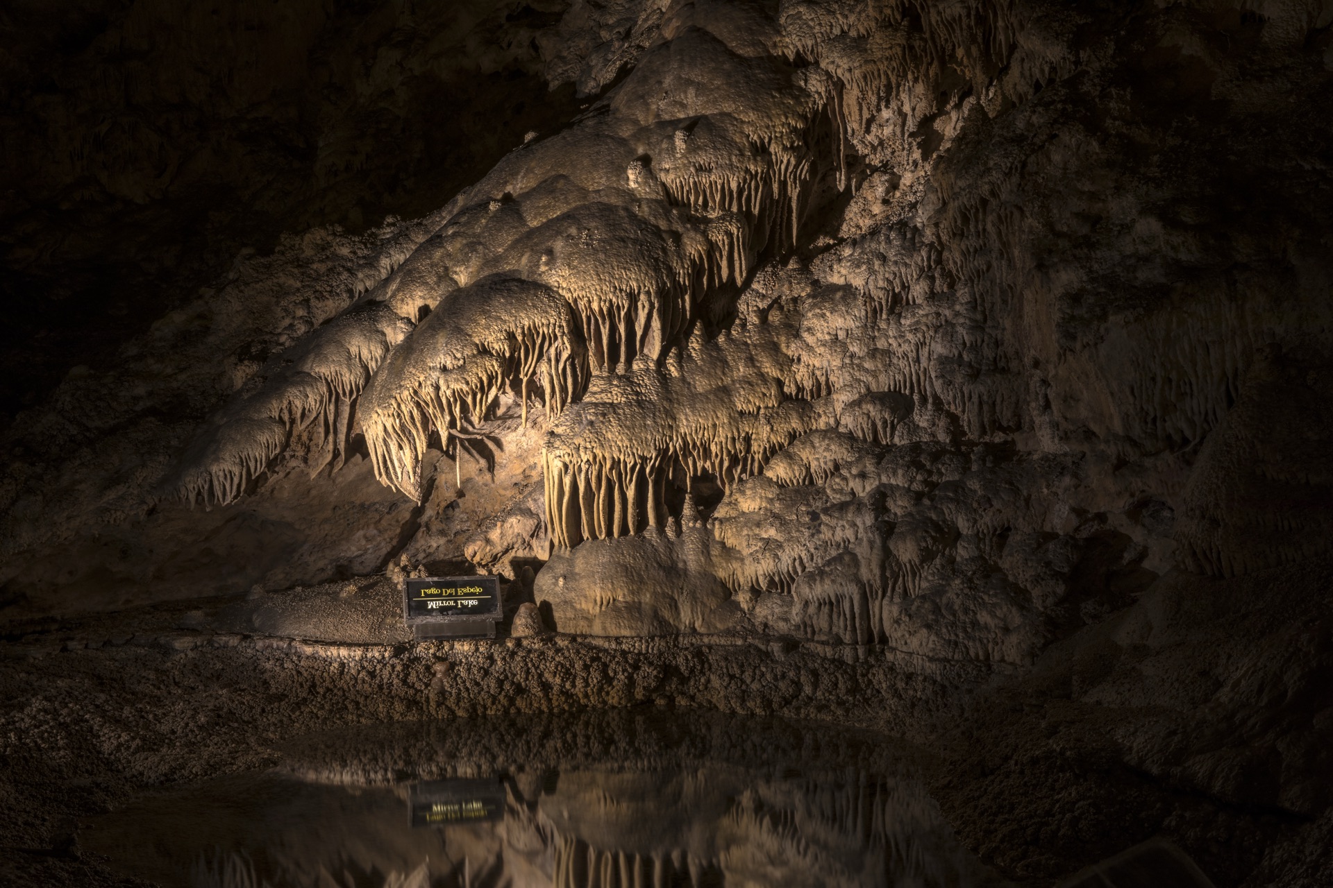 Mirror Lake reflecting cave formations in the Big Room at Carlsbad Caverns National Park