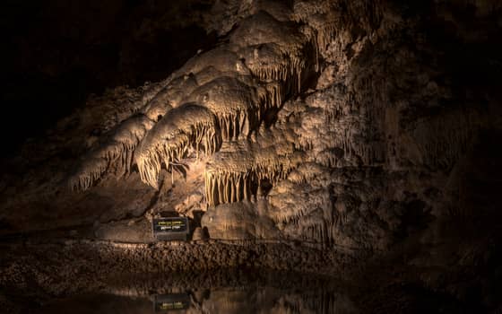 Mirror Lake reflecting cave formations in the Big Room at Carlsbad Caverns National Park